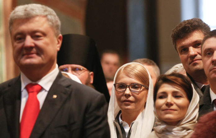 Ukrainian President Poroshenko and opposition politician Tymoshenko attend a ceremony to enthrone Metropolitan Epifaniy, head of the Orthodox Church of Ukraine, in Kiev